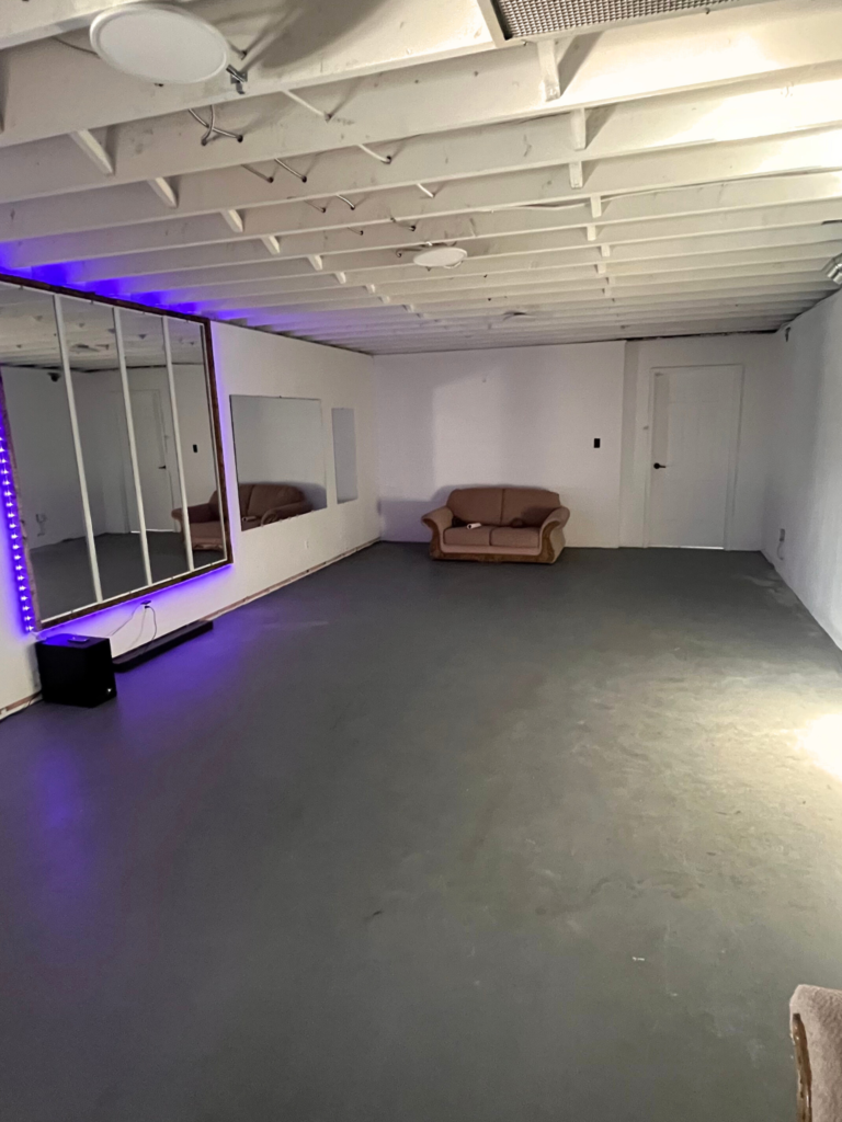 image of the dance room. a 650 square foot aerobics-style room with LED lighted mirrors on the wall.